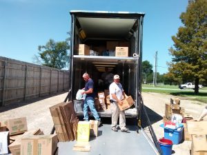 ISA CEO off loads relief supplies